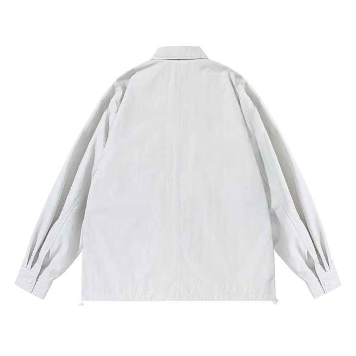 Unisex Oversize-Hemdjacke mit Druckknopfleiste und Pattentaschen Echoarchiv