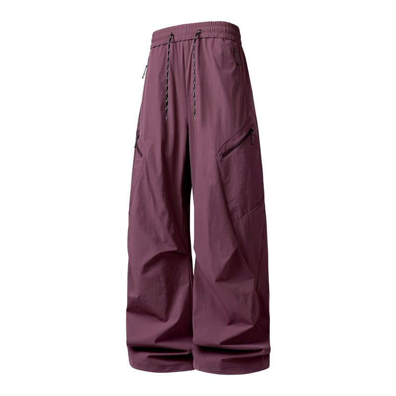 Herren Oversize-Utility-Cargo-Hose aus leichtem Nylon mit elastischem Kordbund, seitlichen Reißverschlusstaschen & weiter Ballon-Silhouette Echoarchiv