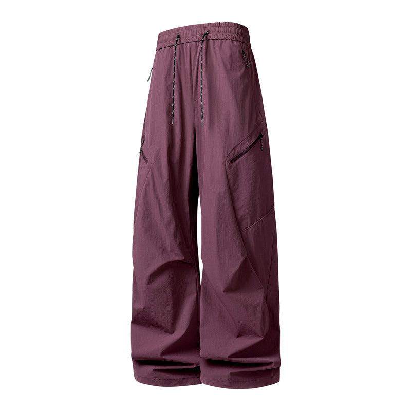 Herren Oversize-Utility-Cargo-Hose aus leichtem Nylon mit elastischem Kordbund, seitlichen Reißverschlusstaschen & weiter Ballon-Silhouette Echoarchiv