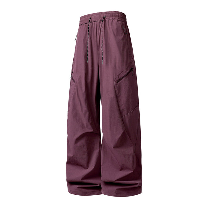 Herren Oversize-Utility-Cargo-Hose aus leichtem Nylon mit elastischem Kordbund, seitlichen Reißverschlusstaschen & weiter Ballon-Silhouette Echoarchiv