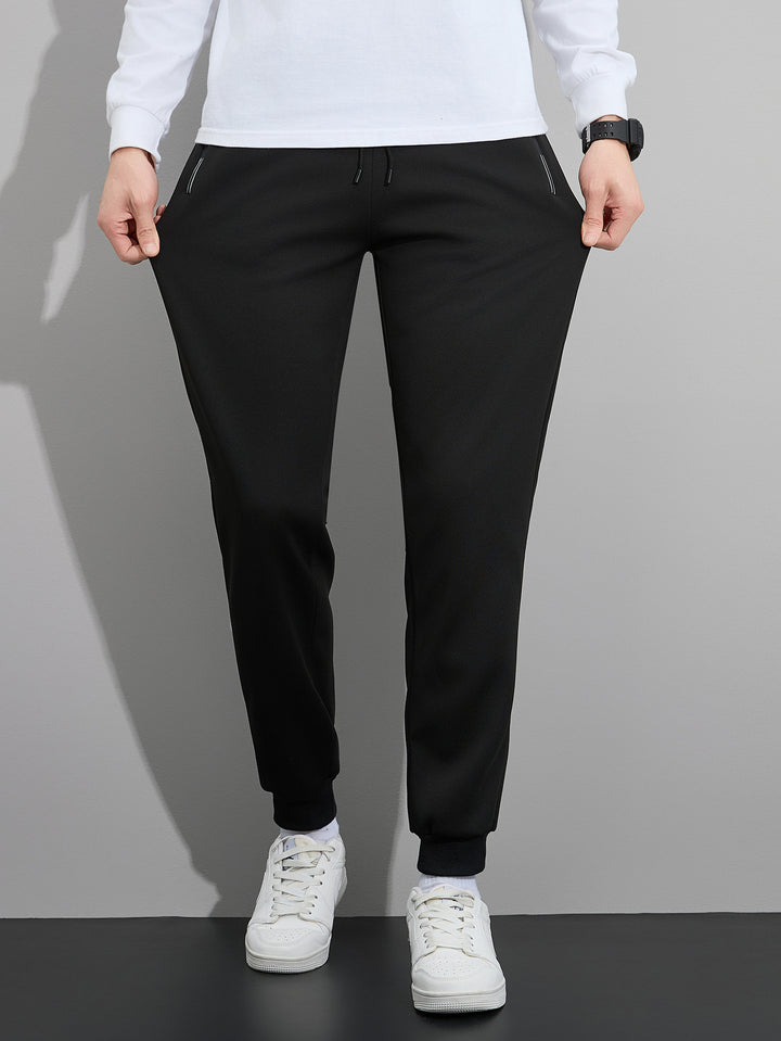 Herren Tapered Performance-Jogginghose mit elastischem Bund, Reißverschlusstaschen & gerippten Beinbündchen Echo Archiv
