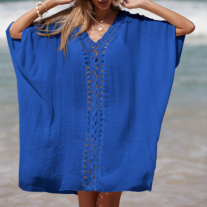 Damen eleganter Strandponcho mit raffinierten Häkelakzenten und tiefem V-Ausschnitt Echo Archiv