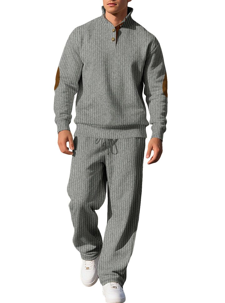 Herren nan feiner Rippstrickpullover mit halber Knopfleiste hohem Stehkragen und kontrastierendem Suedine-Ellbogenbesatz Echo Archiv