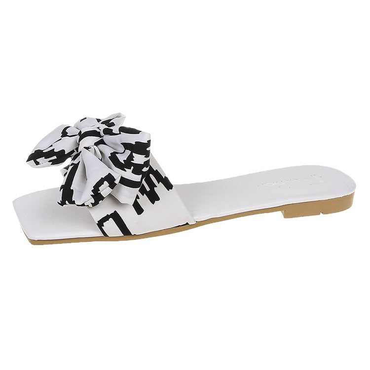 Damen Flache Riemen-Slides mit großem Stoffknoten und quadratischer Zehenpartie – Sorelia