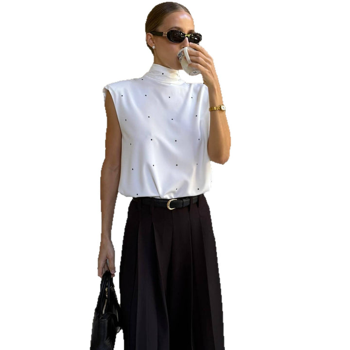 Damen Elegantes Oberteil mit hohem Kragen und feinen Punkten Echo Archiv