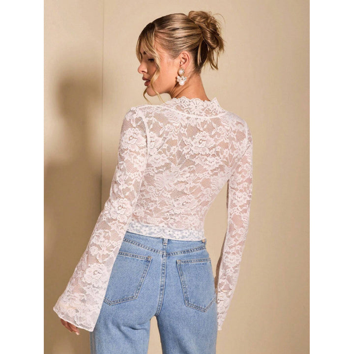 Damen Spitze Bluse mit eleganten Trompetenärmeln und V-Ausschnitt Echo Archiv