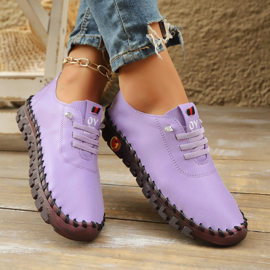 Damen Bequeme Lederoptik-Slipper mit flexibler Profilsohle und Mokassin-Naht – Lioré