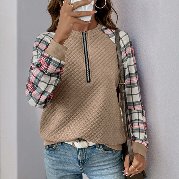 Damen Gesteppter Raglan-Sweatpullover mit halbem Reißverschluss und Karoärmeln Echoarchiv