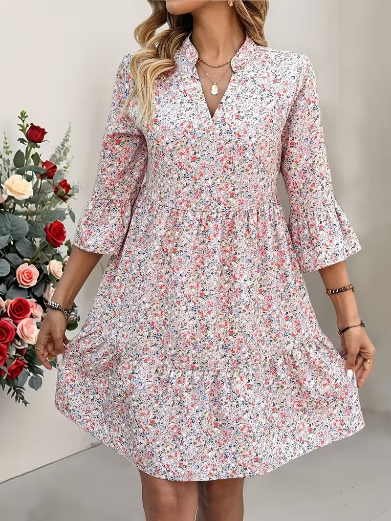 Damen Florales Babydoll-Kleid mit V-Ausschnitt, hohem Empire‑Bund und Glockenärmeln Echo Archiv