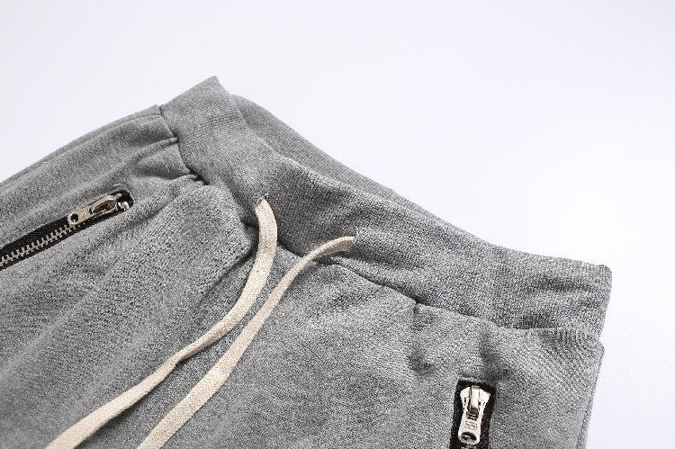 Herren Sportliche Jogginghose im modernen Design mit seitlichen Reißverschlüssen Echoarchiv