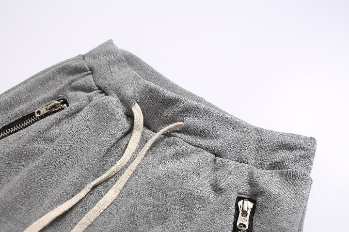 Herren Sportliche Jogginghose im modernen Design mit seitlichen Reißverschlüssen Echoarchiv