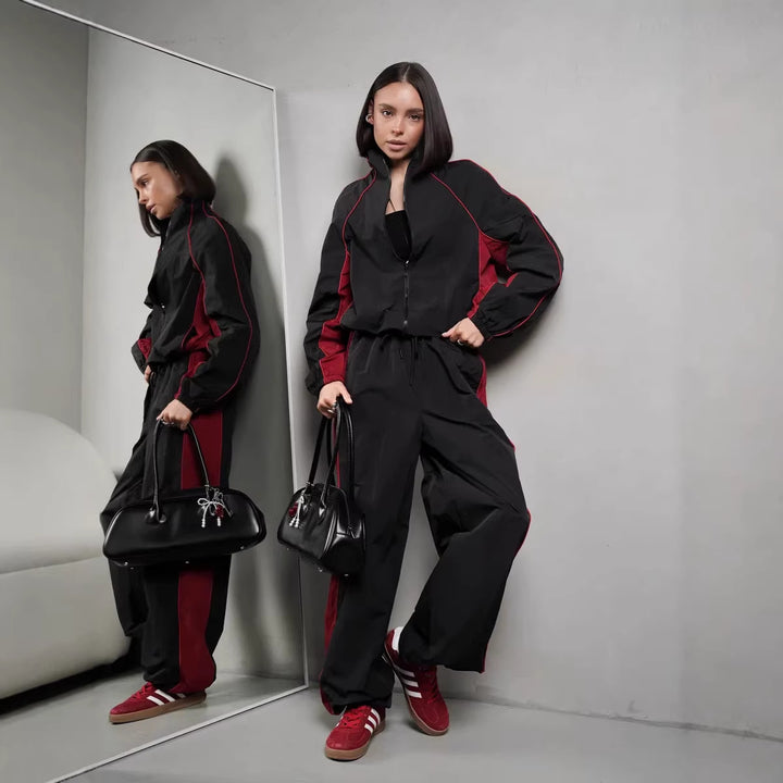 Damen sportlich-elegantes Trackset mit Stehkragen, Reißverschlussjacke und weitem Seitenstreifen-Hose – Avérine