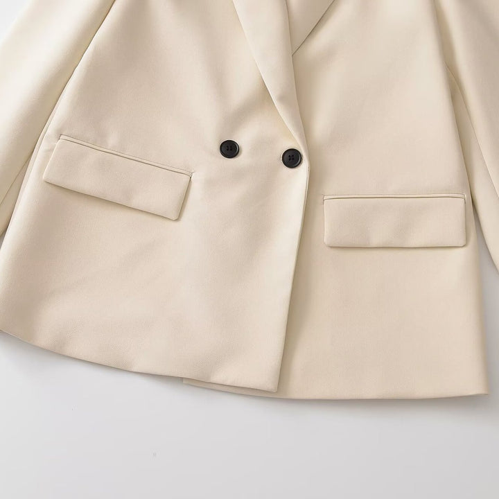 Damen Doppelreihiger Longblazer mit Reverskragen, tailliertem Schnitt und Pattentaschen Echoarchiv