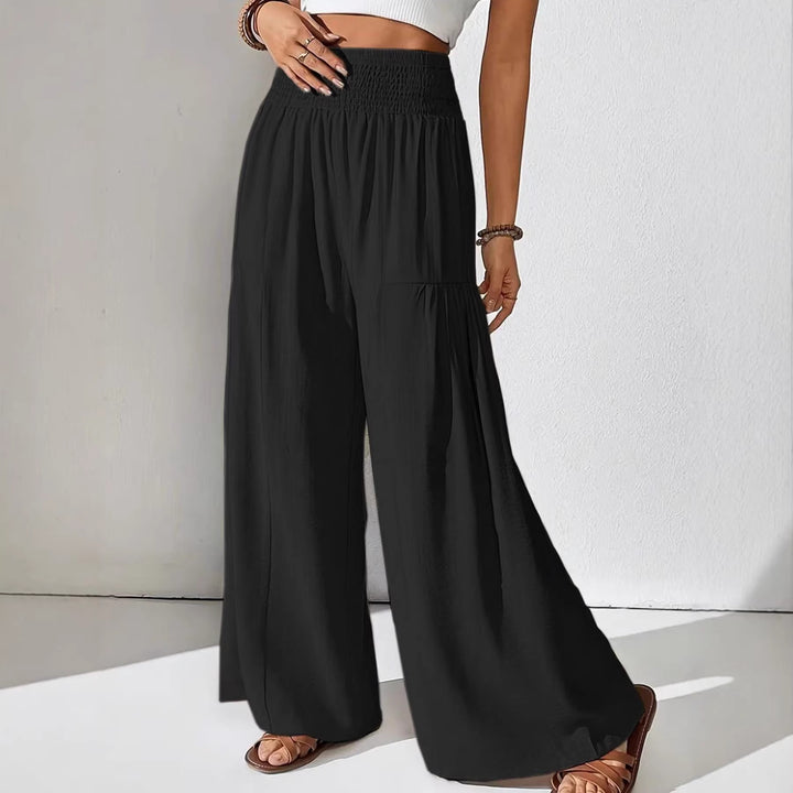 Damen weite Palazzo-Hose mit gerafftem Smock-Bund und Stufendetails – Avélisse