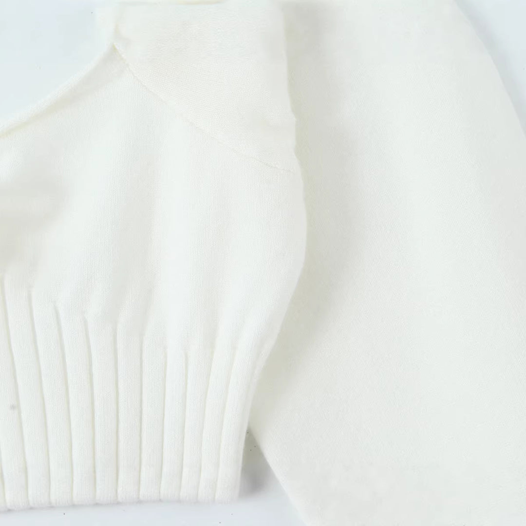 Damen Cropped-Feinstrickpullover mit taillierter Rippenstruktur, V-Ausschnitt, Rüschenbesatz und Ballonärmeln Echoarchiv
