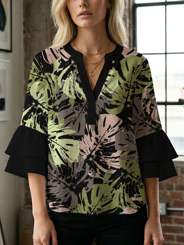 Damen Blusenshirt mit voluminösen Ärmeln und kreativem Druckdesign Echo Archiv