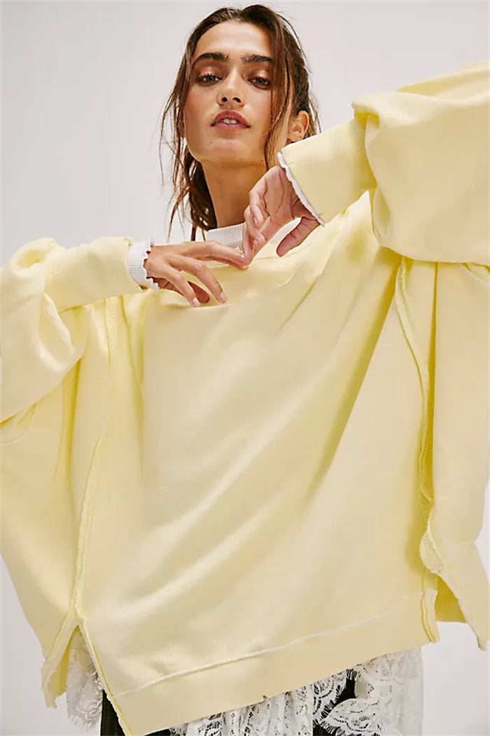 Damen oversized Sweatshirt mit Ballonärmeln, offenen Saumnähten und seitlichen Schlitzen – Avérine