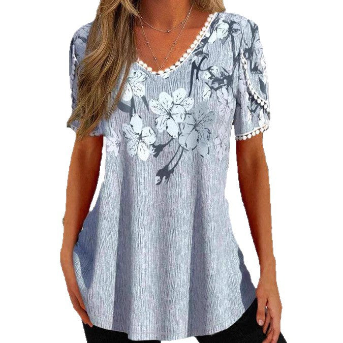 Damen nan legeres V-Ausschnitt-Tunikashirt mit floralem Muster und Pomponbesatz Echo Archiv