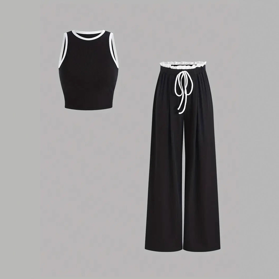 Damen stylishes Sport-Set mit hoch taillierter Weitbein-Hose und sportlichem Bustier Echo Archiv