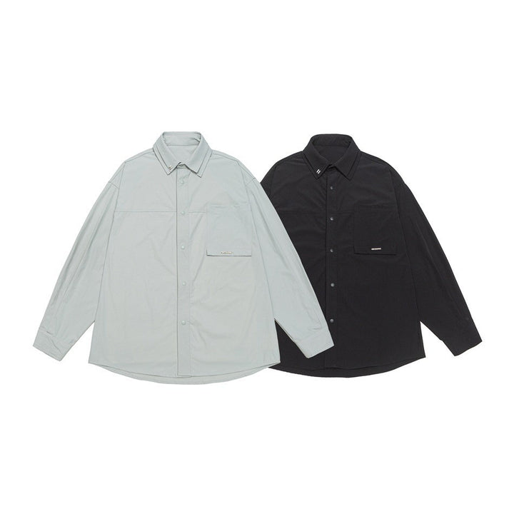 Unisex Oversize Hemd mit technischem Material, Brustklappe und gerundetem Saum Echoarchiv