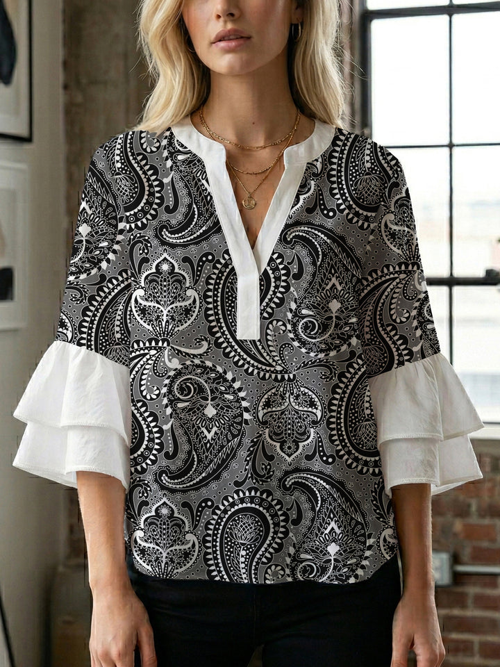 Damen Bluse mit voluminösen Flügelärmel und intensivem Blattmuster Echo Archiv