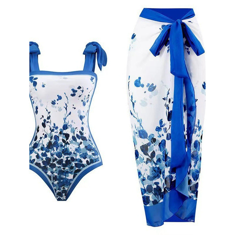 Damen Einteiliger Badeanzug mit stilvollem Wickelrock und modischem Muster Echo Archiv