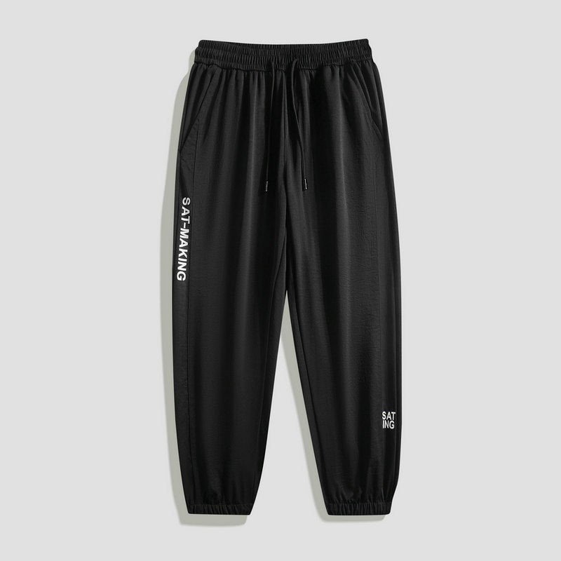 Herren Sportliche Jogginghose mit elastischem Bund und Reißverschlusstaschen Echo Archiv