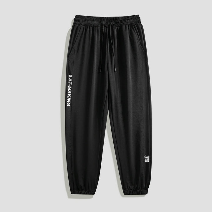 Herren Sportliche Jogginghose mit elastischem Bund und Reißverschlusstaschen Echo Archiv