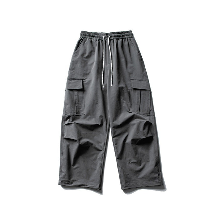 Unisex Weite Cargo-Utility-Hose im Baggy-Schnitt mit elastischem Kordelbund und großzügigen Klappentaschen Echoarchiv