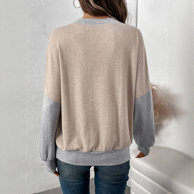 Damen Zweifarbiger Oversize-Langarmpullover mit Kontrastärmeln und V-Naht Echoarchiv