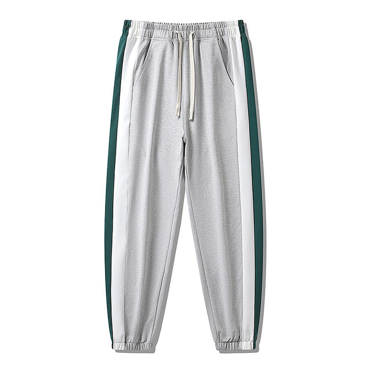 Herren Konische Trackhose mit Kordelzug, seitlichen Colorblock‑Streifen & elastischen Bündchen Echoarchiv