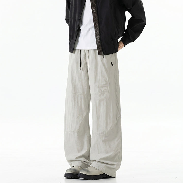 Herren Weite Baggy‑Hose mit Tunnelzugbund und Paneel‑Konstruktion Echo Archiv