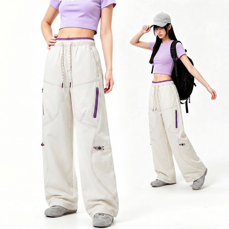 Damen Oversize Tech-Loungehose mit Kontrastnähten, reflektierenden Reißverschlusstaschen & Kordelbund Echoarchiv