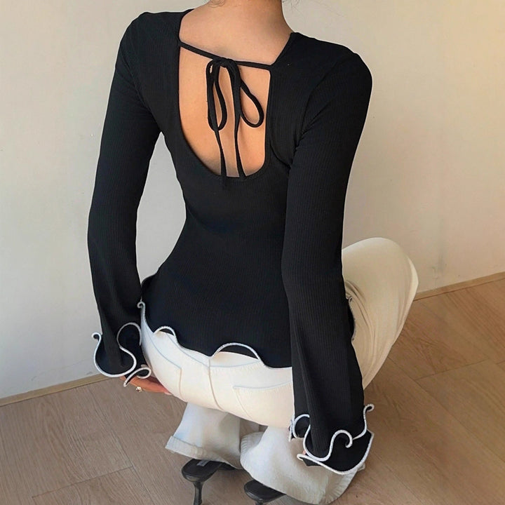 Damen Figurbetontes Langarmshirt mit Volantärmeln und welligem Saum – Avérine