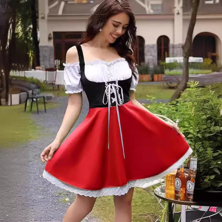 Damen nan schulterfreies Dirndlkleid mit geschnürter Korsage, Puffärmeln und Spitzenunterrock Echo Archiv