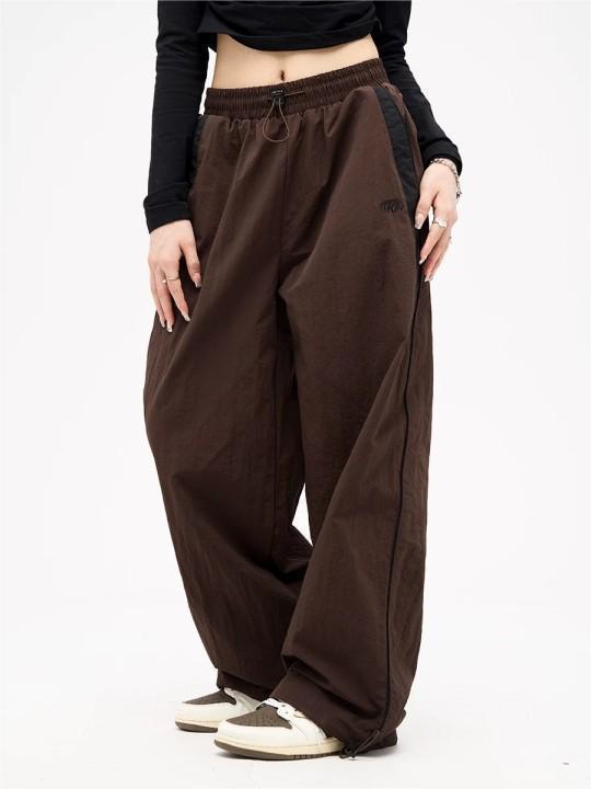 Damen nan weite Trackhose mit Kontrastpaspel, elastischem Bund und Oversize-Schnitt Echo Archiv