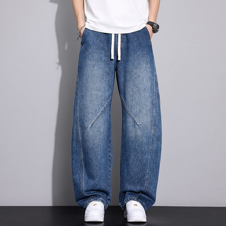 Herren Weite Baggy-Jeanshose mit Tunnelzugbund, markanten Teilungsnähten & elastischem Saum Echoarchiv
