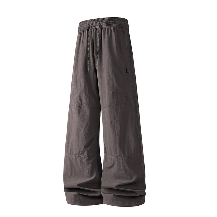 Herren Weite Baggy‑Hose mit Tunnelzugbund und Paneel‑Konstruktion Echo Archiv