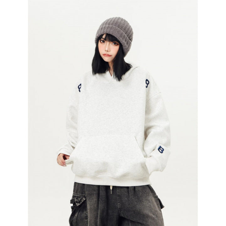 Unisex Oversized Kapuzenpullover mit großflächigem Intarsien‑Blockprint und geripptem Saum Echoarchiv