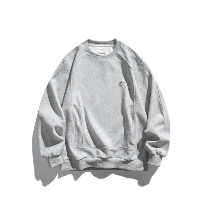 Unisex Oversize-Sweatshirt aus French-Terry mit Raglanärmeln, verdeckten Eingrifftaschen und kleinem Logopatch Echoarchiv