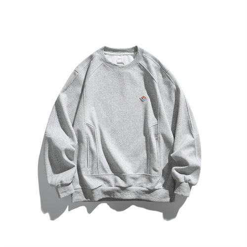 Unisex Oversize-Sweatshirt aus French-Terry mit Raglanärmeln, verdeckten Eingrifftaschen und kleinem Logopatch Echoarchiv