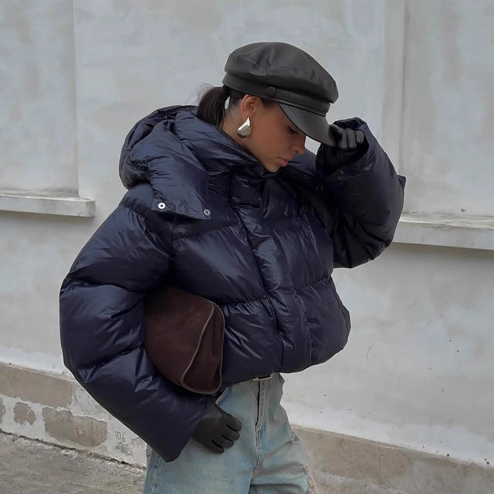 Damen Kurz geschnittene glänzende Oversize-Steppjacke mit hohem Kragen Echoarchiv