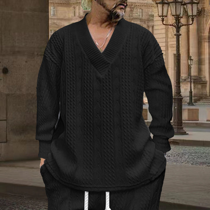 Herren nan grob gestrickter V-Ausschnitt-Pullover mit Zopfmuster und relaxed Fit Echo Archiv