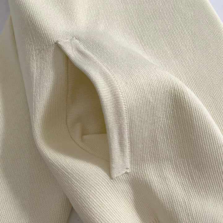 Damen Boxy-Strickjacke mit Stehkragen, Hornoptik-Knopfleiste und Eingrifftaschen Echoarchiv