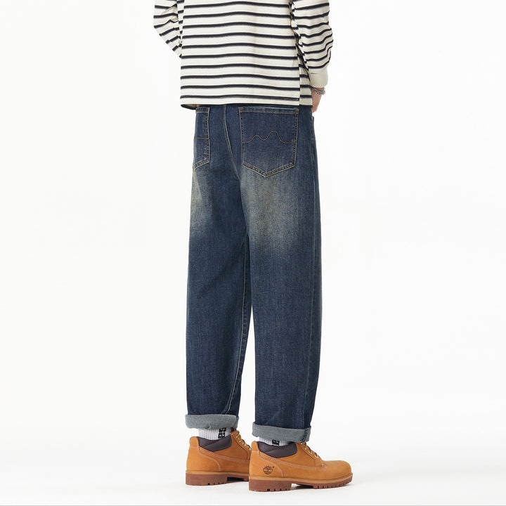 Herren Weite gerade geschnittene Denim-Jeans mit Used‑Wash und Umschlagbund Echoarchiv