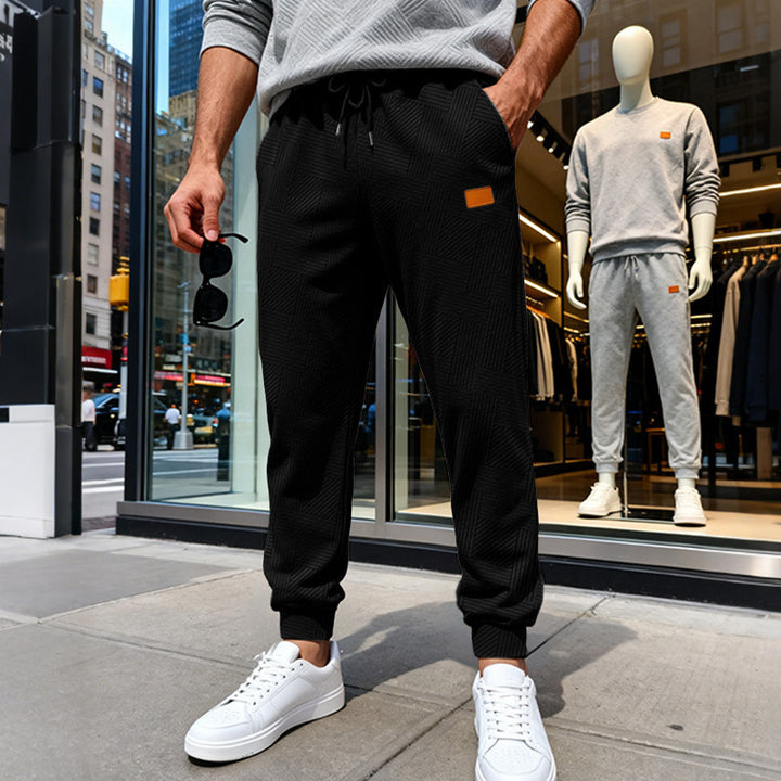 Herren Stepp-Jogginghose mit geometrischem Strukturmuster Echoarchiv