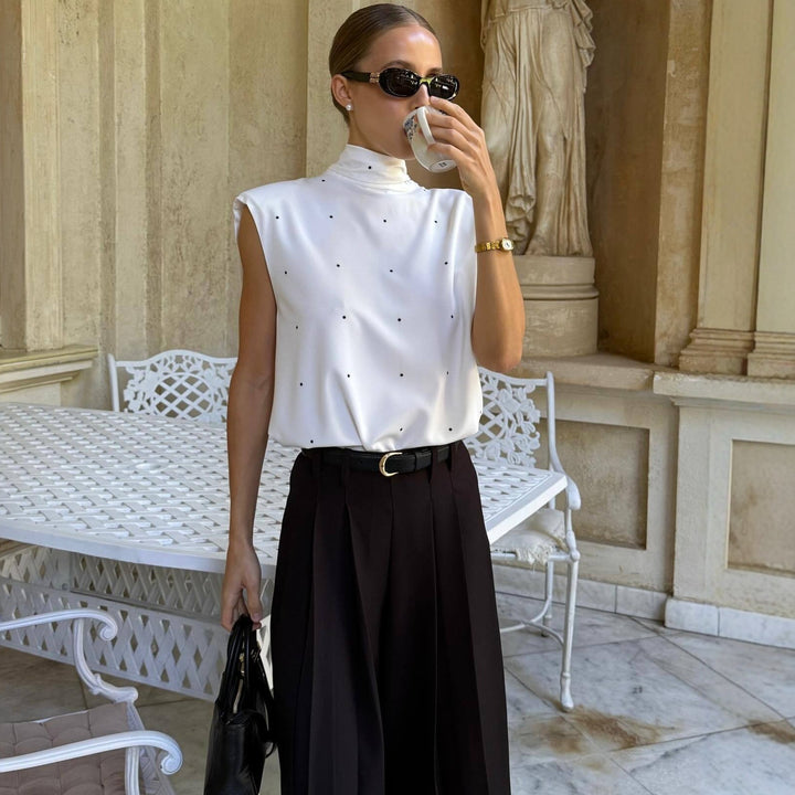 Damen Elegantes Oberteil mit hohem Kragen und feinen Punkten Echo Archiv