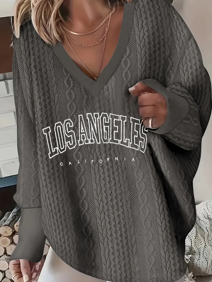 Damen nan Oversize-Zopfmuster-Strickpullover mit V-Ausschnitt und Logo-Print Echo Archiv