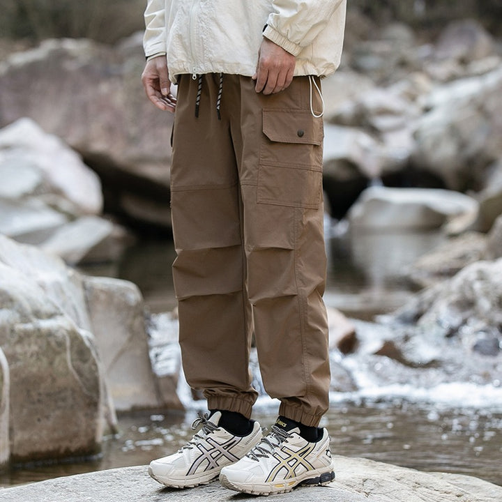 Herren Weite Relaxed-Cargo-Freizeithose mit Tunnelzugbund & Multifunktions‑Taschen Echoarchiv