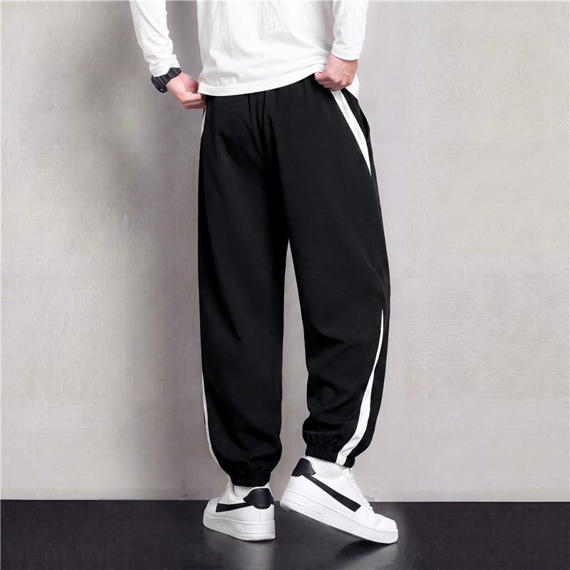 Herren Athleisure Jogginghose im Baggy‑Schnitt mit elastischem Bund, Tunnelzug und seitlichen Kontrastkeilen Echoarchiv